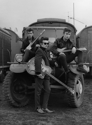 Astrid Kirchherr, John Lennon, Stuart Sutcliffe and George Harrison on a truck at the Fairground, 1960.