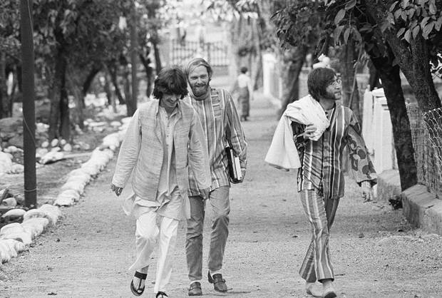 Roll up, Roll up: The Beatles George Harrison (Left) and John Lennon (right), with Mike Love of the Beach Boys, in New Dehli. Photo / Getty