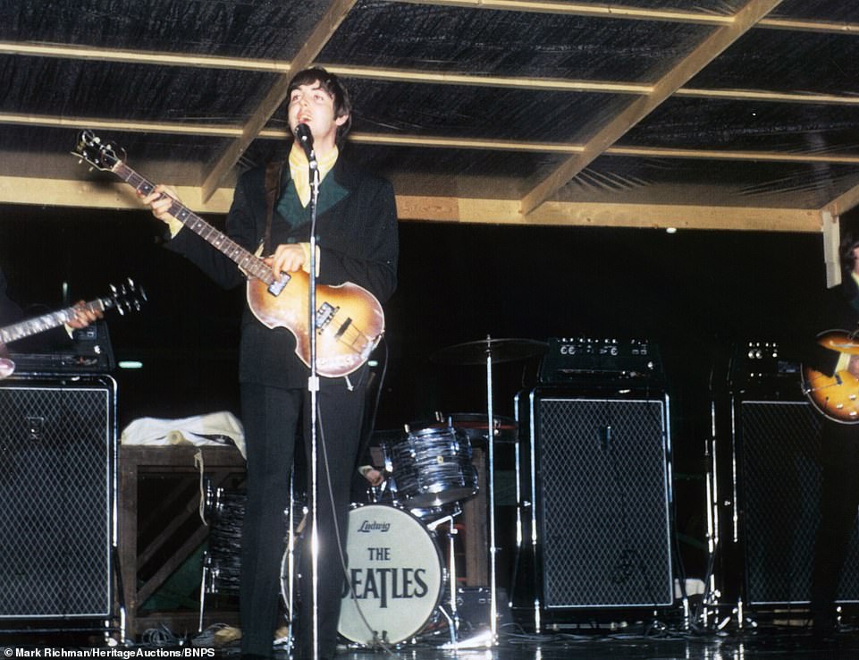 Paul McCartney sings and plucks his bass guitar in this photo slide of the Fab Four's 1966 US tour, which is going under the hammer in an online auction