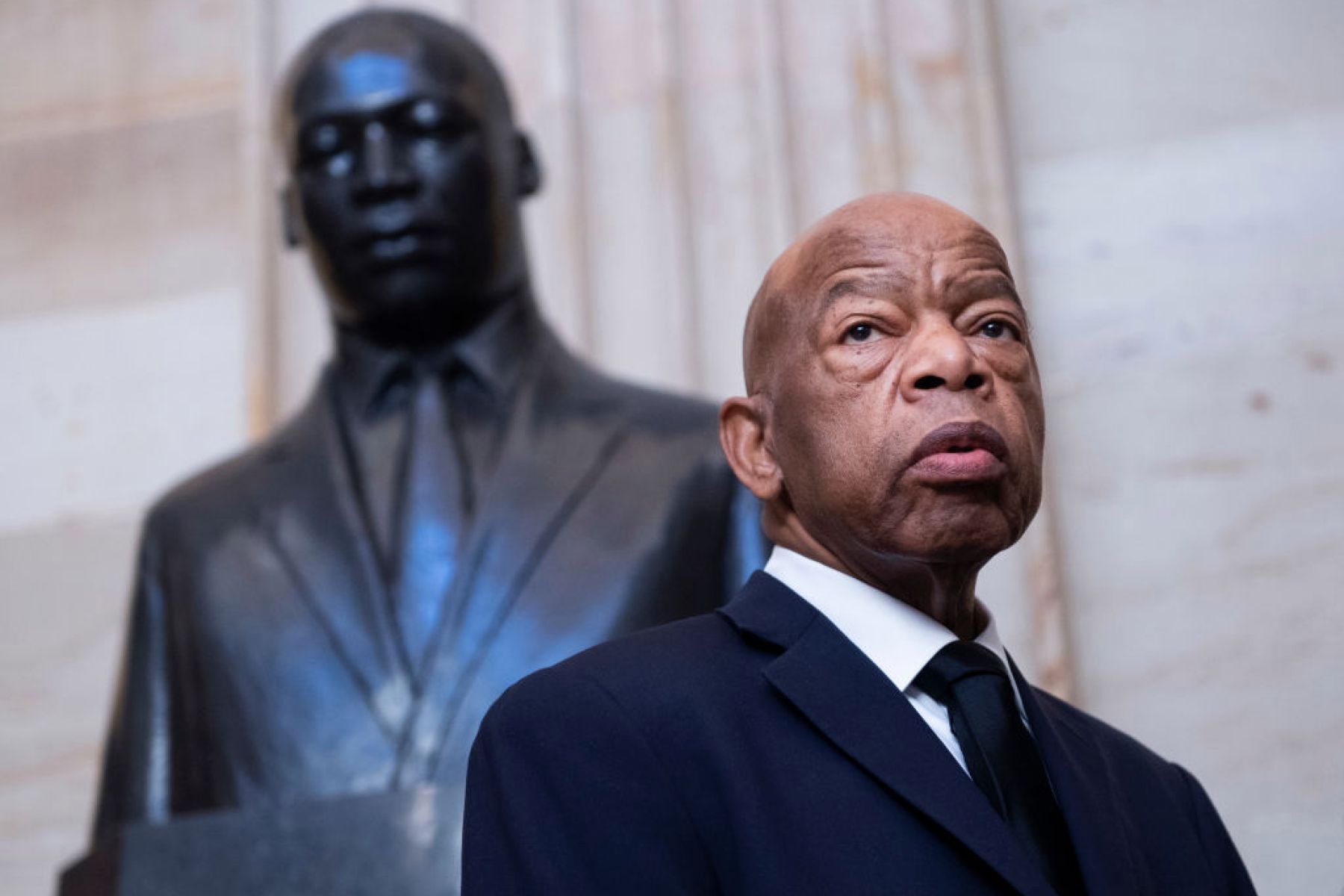 UNITED STATES - OCTOBER 24: Rep. John Lewis, D-Ga., is seen near the statue of Dr. Martin Luther King, Jr., in the Capitol Rotunda before a memorial service for the late Rep. Elijah Cummings, D-Md., in Statuary Hall on Thursday, October 24, 2019. (Photo By Tom Williams/CQ-Roll Call, Inc via Getty Images),