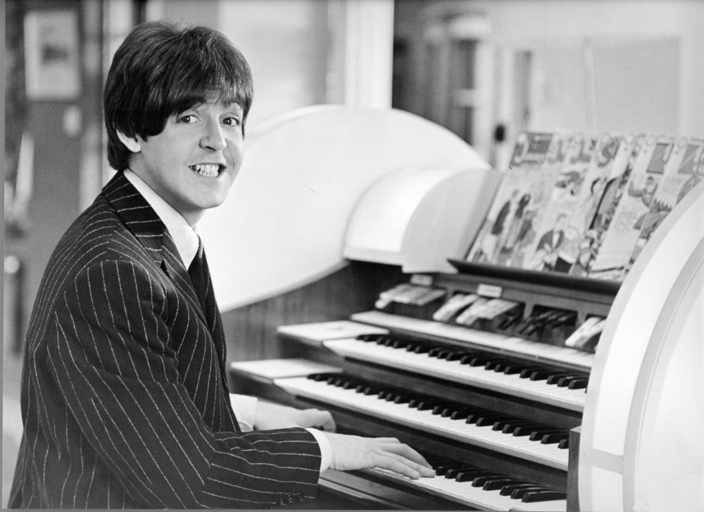 Paul McCartney playing a paino