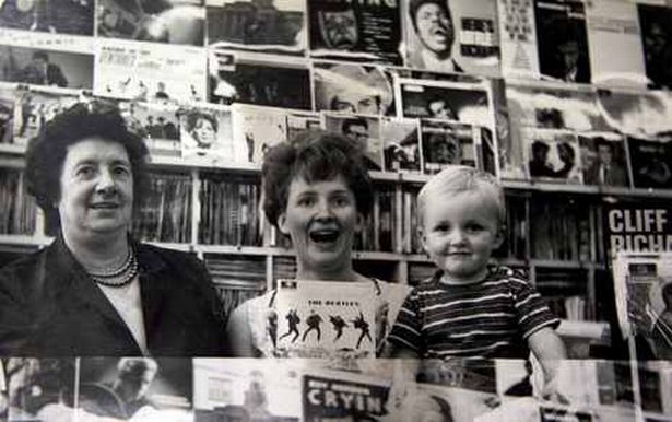 Dorothy Cain, Diane Cain and son Tony inside the family record shop, Musical Box, on West Derby Road in Liverpool circa 1963.