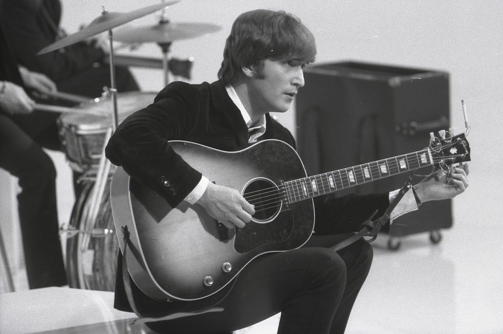 John Lennon playing the guitar