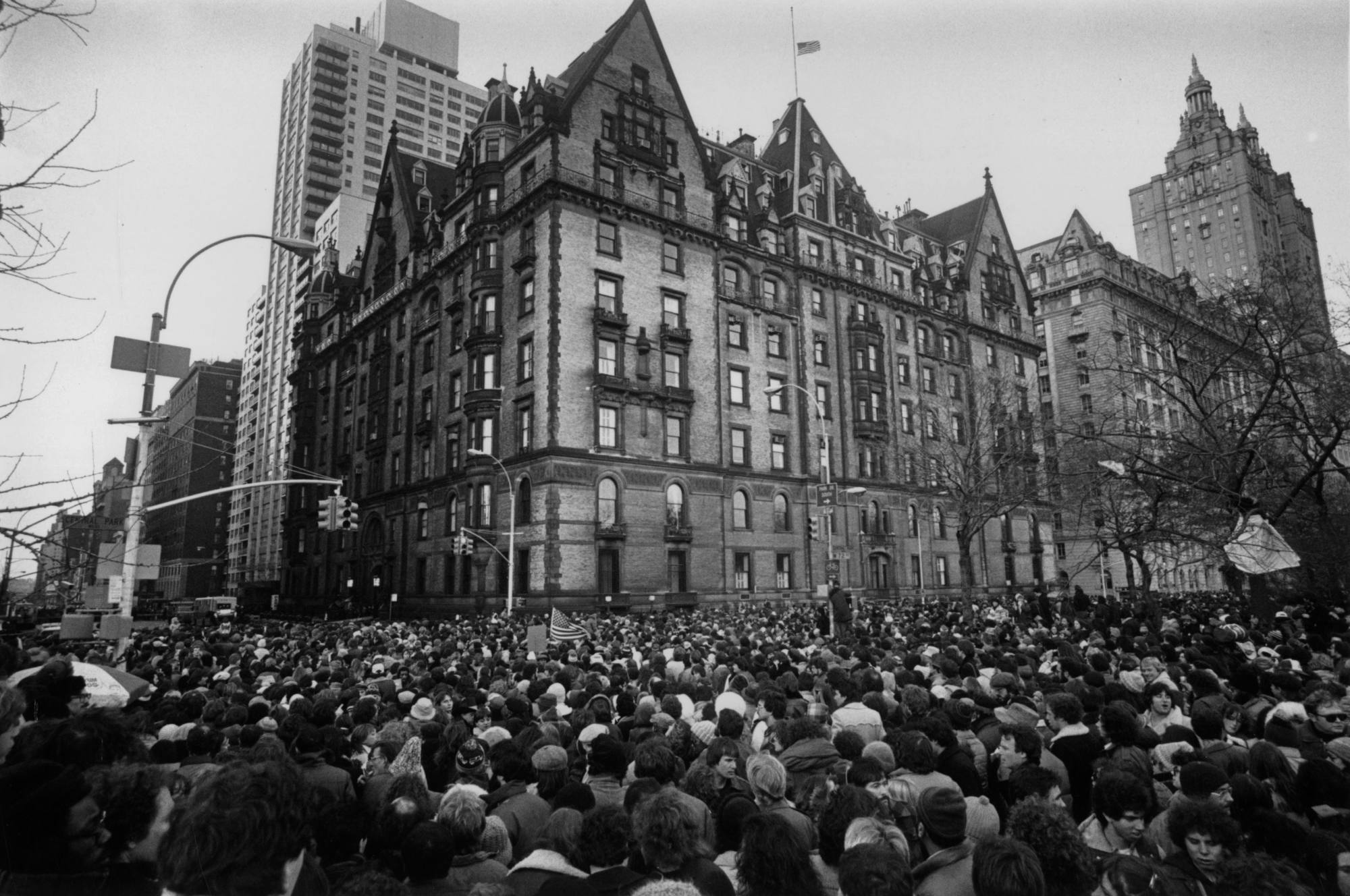 Crowds gather outside the home of John Lennon in New York in December, 1980, after the news that he had been shot and killed. Photo: Getty Images